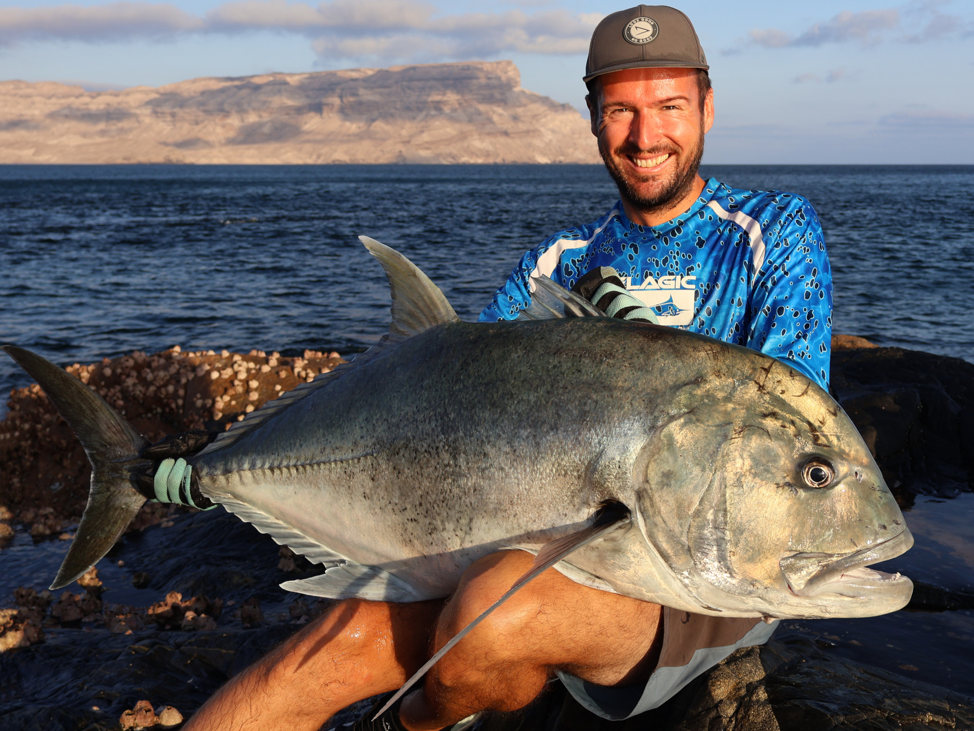 Big Giant Trevally while rock fishing, Oman Khuriya Muriya Islands